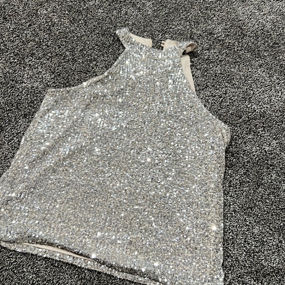 Sequin tank button behind the neck